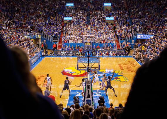 KU men’s basketball team playing on the court at Allen Fieldhouse