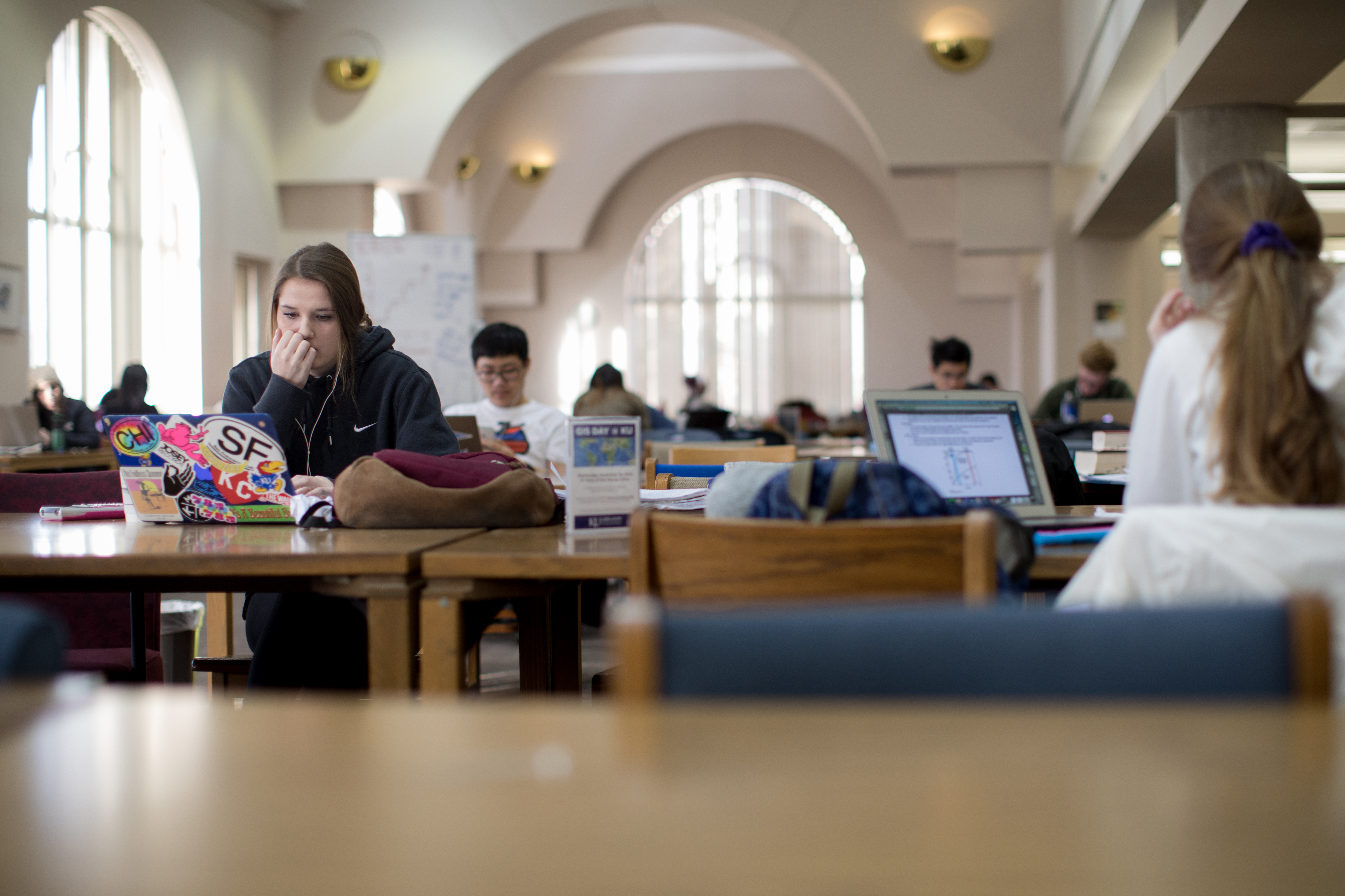 students working at tables in Anschutz Library