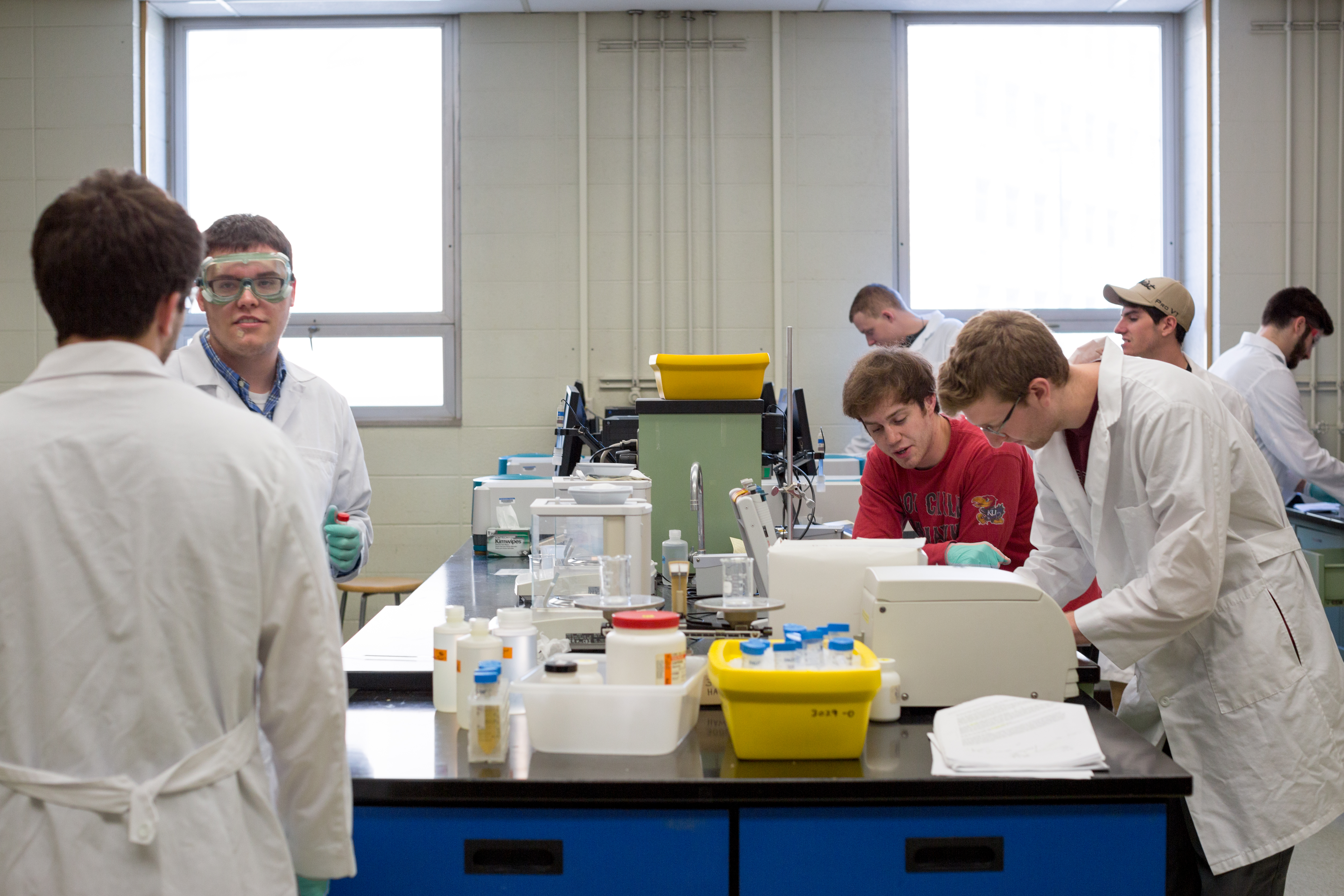 groups of pharmacy students working in a lab inside Malott Hall on KU’s Lawrence campus