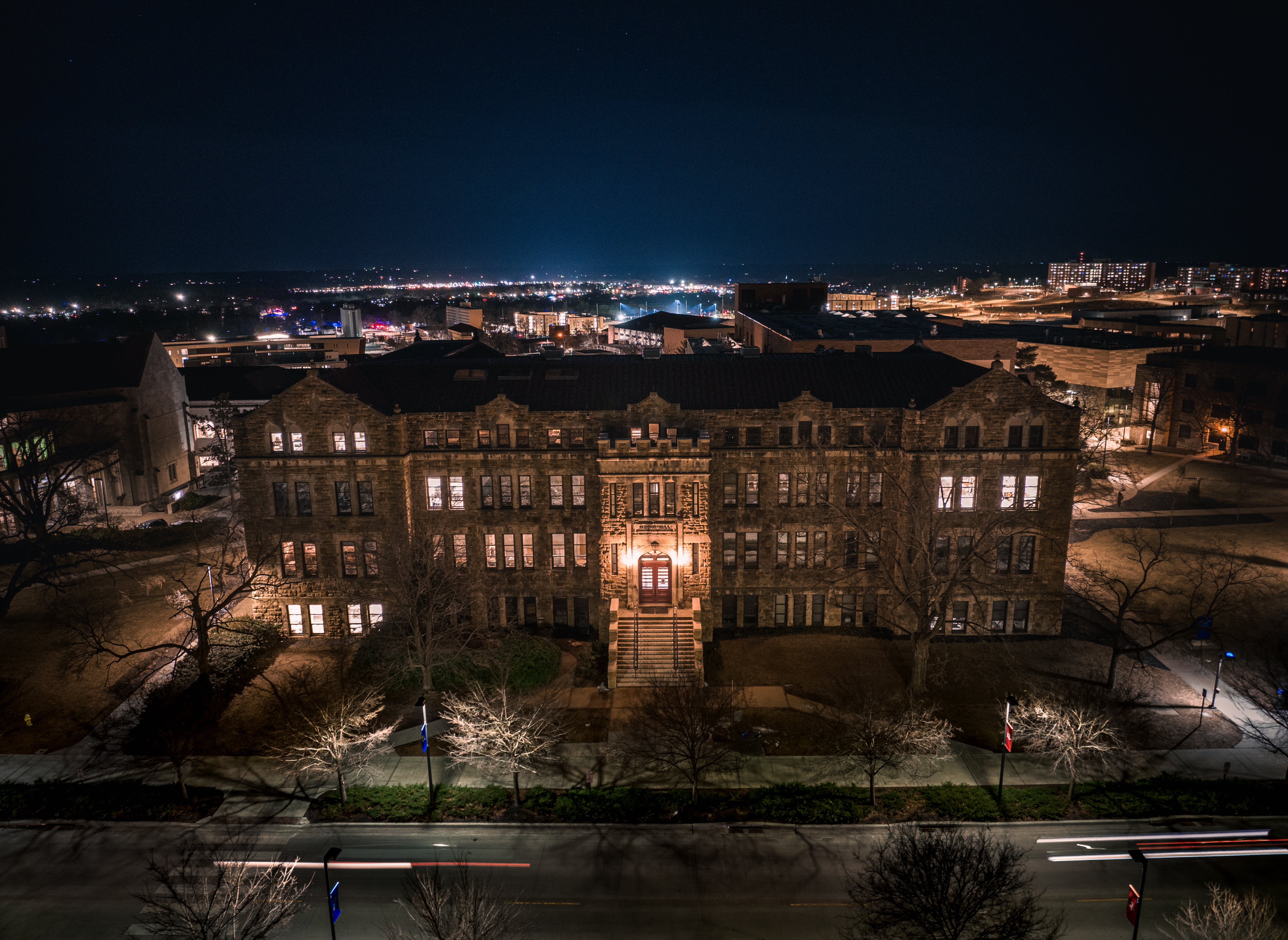 Aerial nighttime view of an illuminated Marvin Hall
