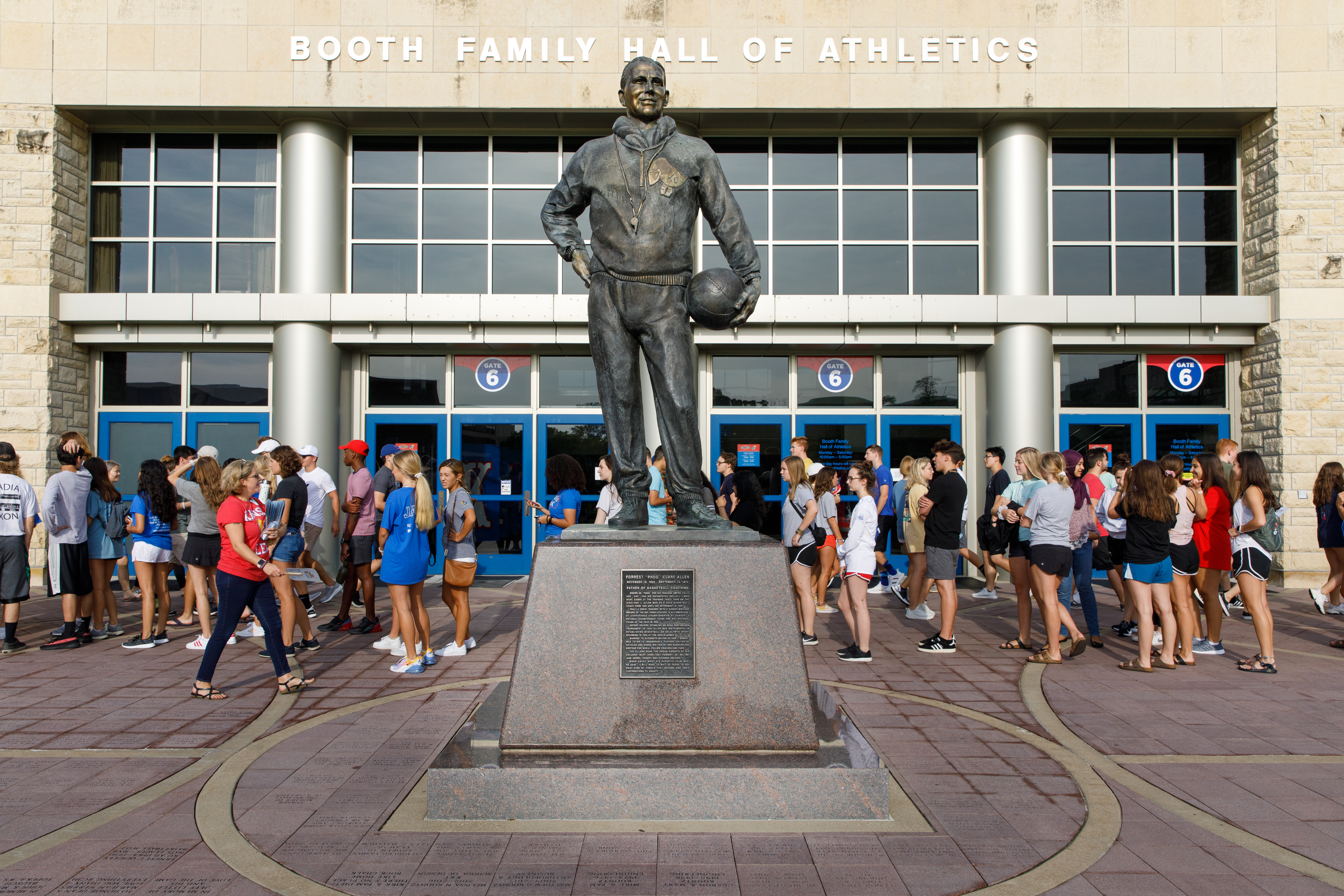 Students behind The Phog Allen statue during a game day