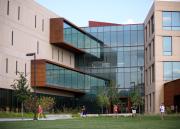students walk past Capitol Federal Hall