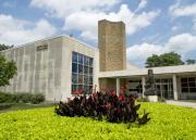 Tulips bloom in front of the statue of Moses at Smith Hall