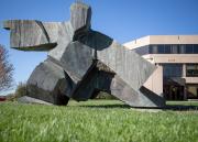 A sculpture depicting a martial arts pose in front of Green Hall No secondary images
