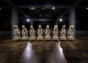 The original limestone Dyche Hall grotesques on display inside the Natural History Museum