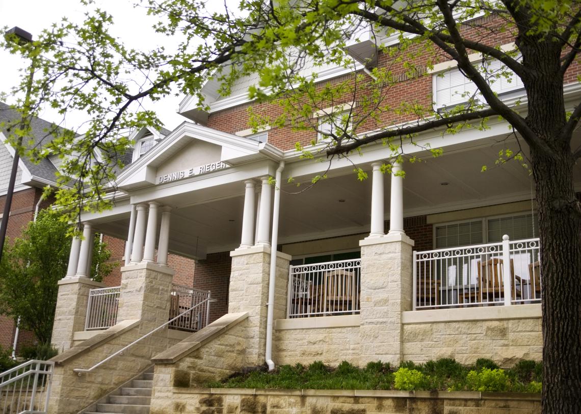An exterior view of the steps and porch of Rieger Hall