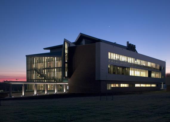 Exterior view of the Multidisciplinary Research Building illuminated from within