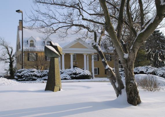 the exterior of Watkins Scholarship Hall after a snowfall