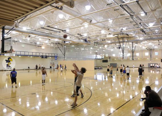 students play basketball on the court at Ambler Student Recreation Fitness Center