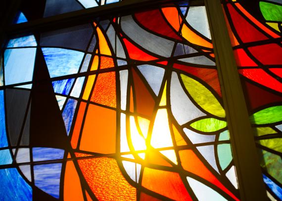 Close-up of sun shining through the stained glass window