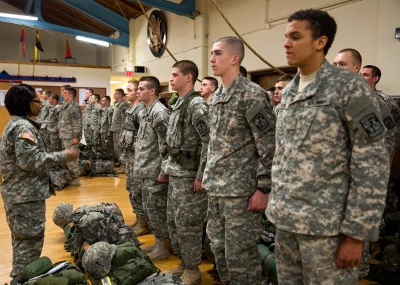 Group of Army soldiers standing at attention and receiving information inside the Military Science Building on KU’s Lawrence campus