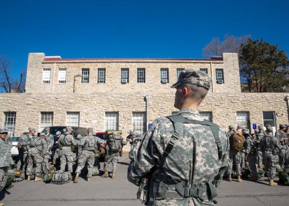 Army soldiers gather their packs outside of the Military Science Building on KU’s Lawrence campus