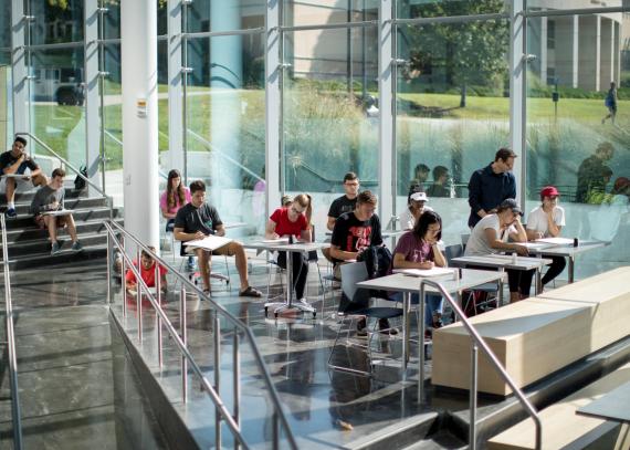 students gather in a study area at the DeBruce Center