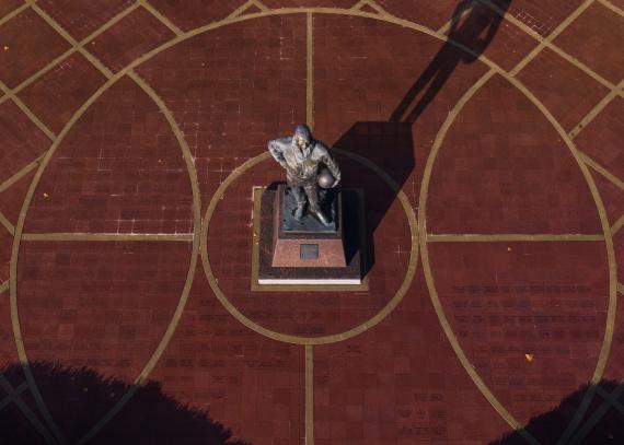 An aerial view of the Phog Allen statue and the brick courtyard with a basketball design