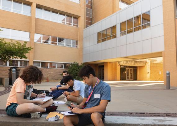 Group of students study outside of Learned Hall