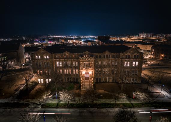 Aerial nighttime view of an illuminated Marvin Hall