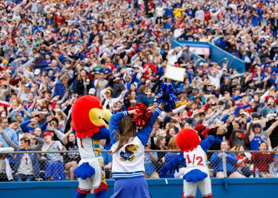 Big Jay and Baby Jay lead the fans at David Booth Kansas Memorial Stadium in a chant.