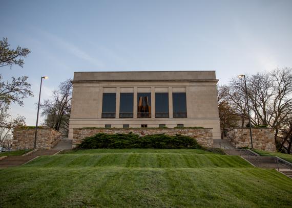 The Spencer Research Library viewed from a grassy slope