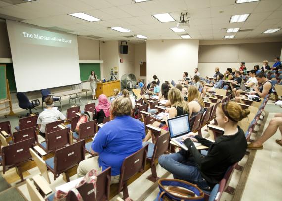 Students in a large classroom in Strong Hall